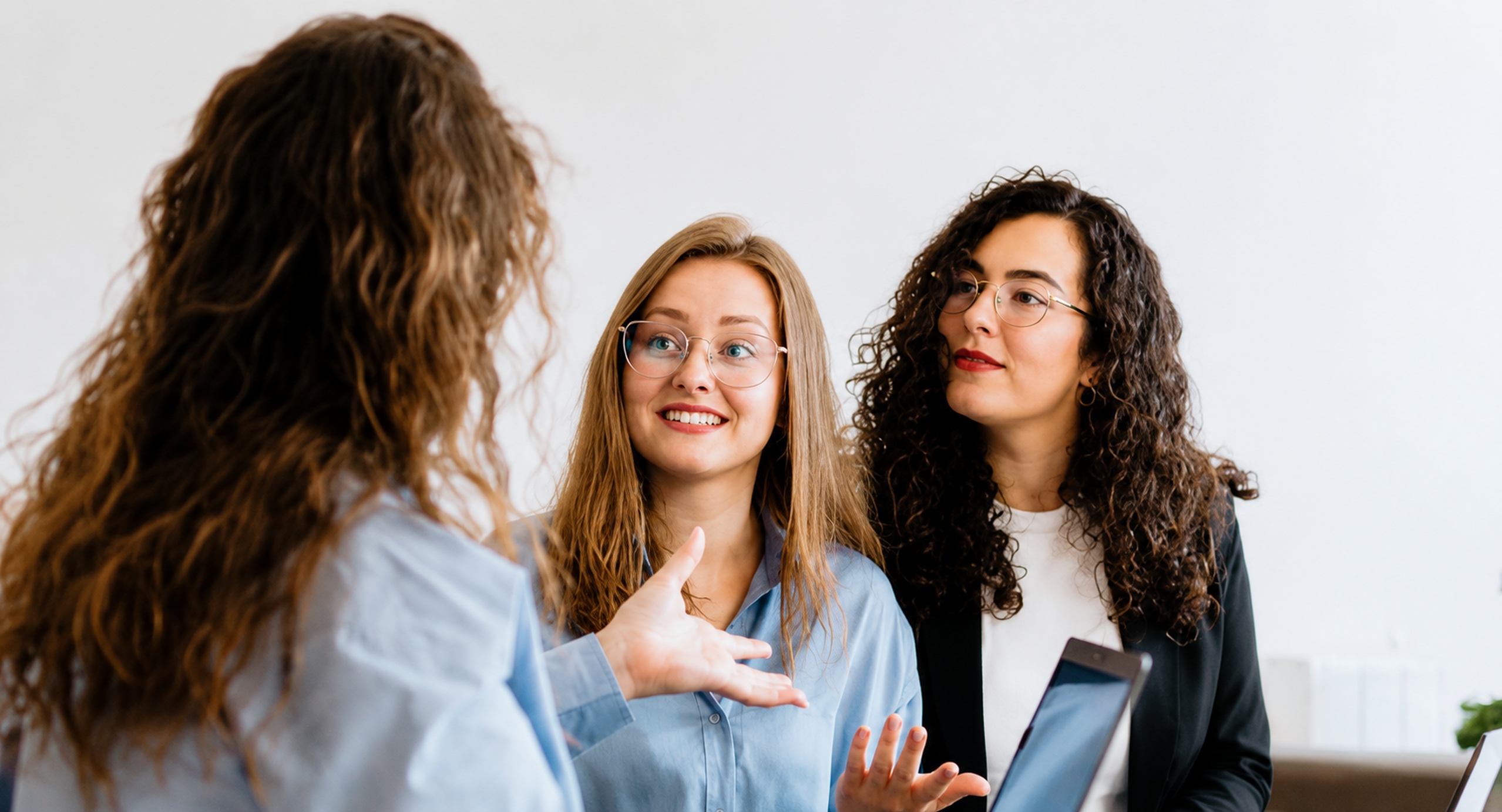 A small group speaking during a therapy session.